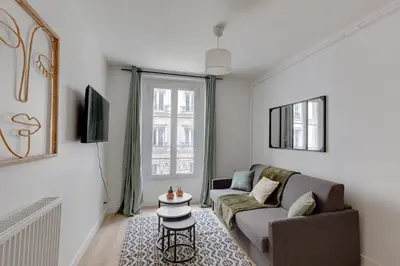 Télévision ou salle de divertissement dans l'établissement 556 Suite Wagram - Superbe Appartement à Paris