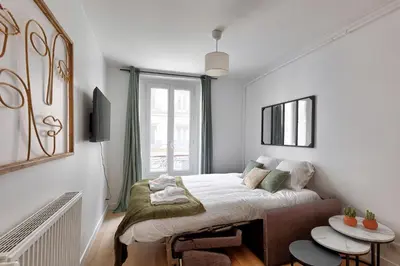 Télévision ou salle de divertissement dans l'établissement 556 Suite Wagram - Superbe Appartement à Paris