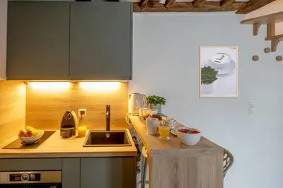 Cuisine ou kitchenette dans l'établissement Studio Isla - Welkeys