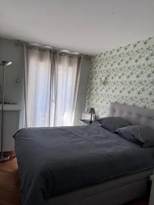 Un ou plusieurs lits dans un hébergement de l'établissement 3 bedrooms with Tour Eiffel view