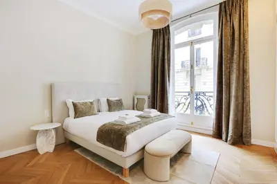 Un ou plusieurs lits dans un hébergement de l'établissement Sublime apartment - 2BR-4P - Arc de Triomphe