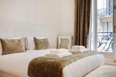 Un ou plusieurs lits dans un hébergement de l'établissement Sublime apartment - 2BR-4P - Arc de Triomphe