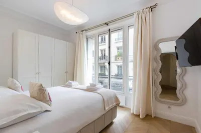 Un ou plusieurs lits dans un hébergement de l'établissement Charming flat - 2BD-6P - Eiffel Tower