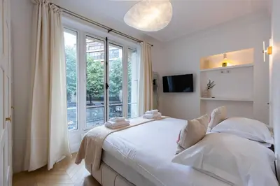Un ou plusieurs lits dans un hébergement de l'établissement Charming flat - 2BD-6P - Eiffel Tower