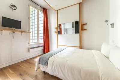 Un ou plusieurs lits dans un hébergement de l'établissement Matignon Cozy Flat