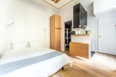 Un ou plusieurs lits dans un hébergement de l'établissement Matignon Cozy Flat