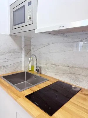 Cuisine ou kitchenette dans l'établissement Elegant and Comfortable Studio Jouvenet