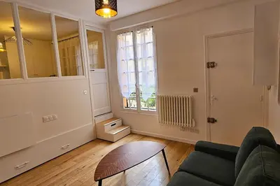 Coin salon dans l'établissement Appartement - Tour Eiffel