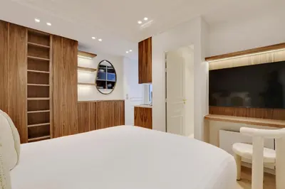 Un ou plusieurs lits dans un hébergement de l'établissement Maison Galante's apartments with Services in La Madeleine - Opéra