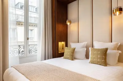 Un ou plusieurs lits dans un hébergement de l'établissement Maison Galante's apartments with Services in La Madeleine - Opéra