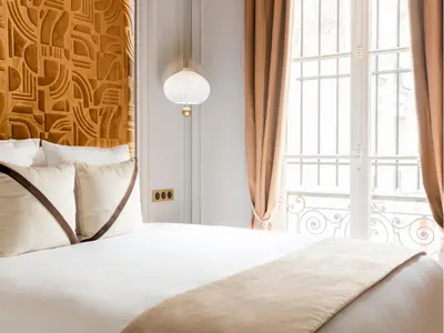 Un ou plusieurs lits dans un hébergement de l'établissement Merveil - Signature Suite - Marais - Caire II