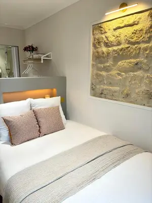 Un ou plusieurs lits dans un hébergement de l'établissement Hotel Paris Amore