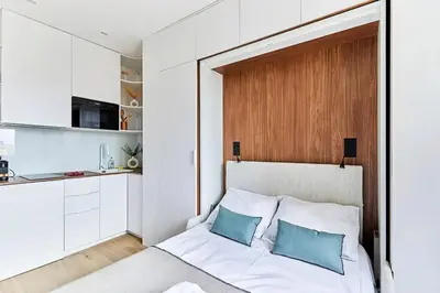 Un ou plusieurs lits dans un hébergement de l'établissement Studio charmant à Paris, près de l'Arc de Triomphe