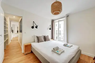 Un ou plusieurs lits dans un hébergement de l'établissement 604 Suite Lizzy - Superbe Appartement à Paris