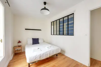 Un ou plusieurs lits dans un hébergement de l'établissement 604 Suite Lizzy - Superbe Appartement à Paris