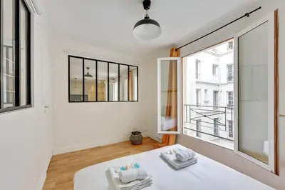 Un ou plusieurs lits dans un hébergement de l'établissement 604 Suite Lizzy - Superbe Appartement à Paris