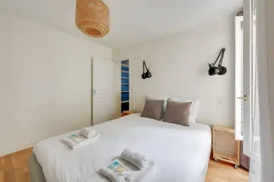 Un ou plusieurs lits dans un hébergement de l'établissement 604 Suite Lizzy - Superbe Appartement à Paris