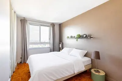 Un ou plusieurs lits dans un hébergement de l'établissement GuestReady - Chic retreat in La Défense