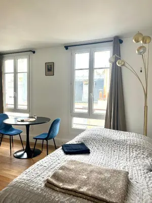 Un ou plusieurs lits dans un hébergement de l'établissement Eiffel Tower - Cosy Studio