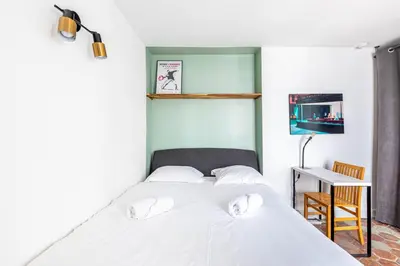 Un ou plusieurs lits dans un hébergement de l'établissement GuestReady - Bel Apt. au cœur de Paris