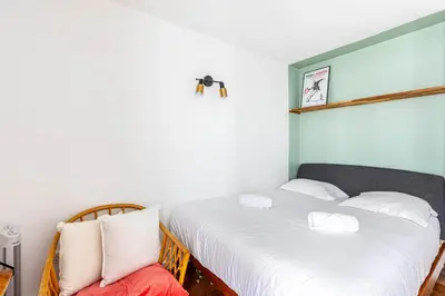 Un ou plusieurs lits dans un hébergement de l'établissement GuestReady - Bel Apt. au cœur de Paris