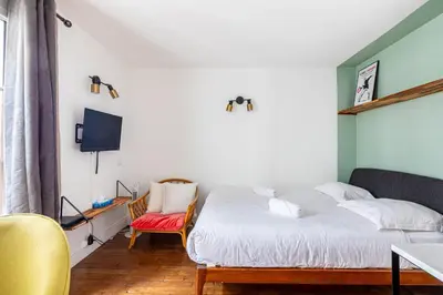Un ou plusieurs lits dans un hébergement de l'établissement GuestReady - Bel Apt. au cœur de Paris