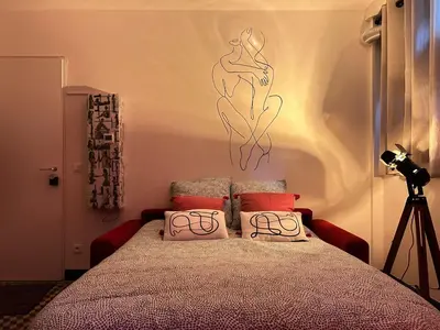 Un ou plusieurs lits dans un hébergement de l'établissement Love room in Paris