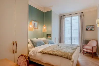 Un ou plusieurs lits dans un hébergement de l'établissement Paris Wagram Design Residence