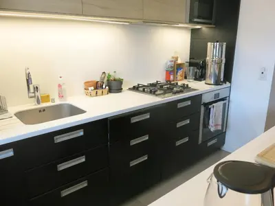 Cuisine ou kitchenette dans l'établissement Appartement St Antoine Nation CityCosy