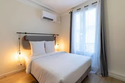 Un ou plusieurs lits dans un hébergement de l'établissement B1#Two Bedrooms#Champs Elysées#Arc de Triomphe#AC