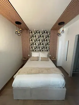 Un ou plusieurs lits dans un hébergement de l'établissement Eiffel tour Cosy Bali