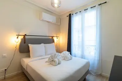 Un ou plusieurs lits dans un hébergement de l'établissement B2#Two Bedrooms#Champs Elysées#Arc de Triomphe#AC