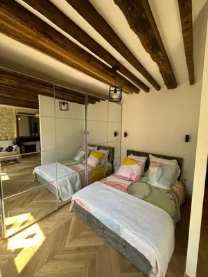 Un ou plusieurs lits dans un hébergement de l'établissement Appartement cosy