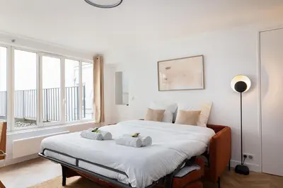Un ou plusieurs lits dans un hébergement de l'établissement Marais Elegance Suite - 1 Bedroom
