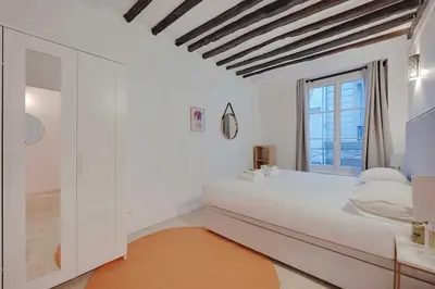Un ou plusieurs lits dans un hébergement de l'établissement Chic apartment - 2BR-6P - Center of Paris