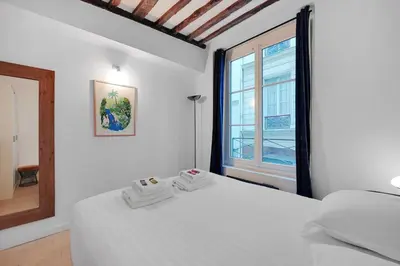 Un ou plusieurs lits dans un hébergement de l'établissement Chic apartment - 2BR-6P - Center of Paris