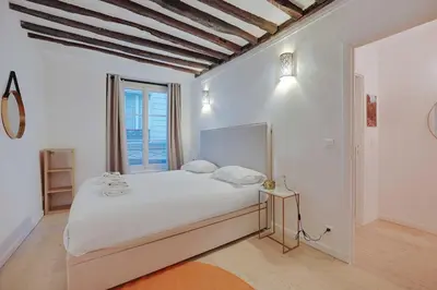 Un ou plusieurs lits dans un hébergement de l'établissement Chic apartment - 2BR-6P - Center of Paris