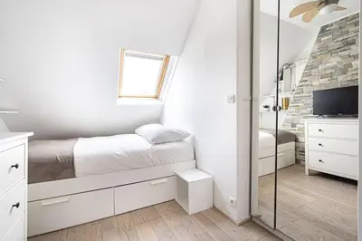 Un ou plusieurs lits dans un hébergement de l'établissement Appartement lumineux et cosy Gare du Nord - Opéra