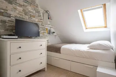 Télévision ou salle de divertissement dans l'établissement Appartement lumineux et cosy Gare du Nord - Opéra