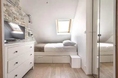 Un ou plusieurs lits dans un hébergement de l'établissement Appartement lumineux et cosy Gare du Nord - Opéra