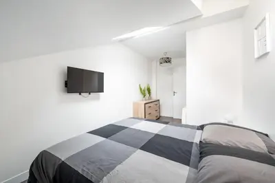 Un ou plusieurs lits dans un hébergement de l'établissement Maison en Centre-Ville - Neuilly
