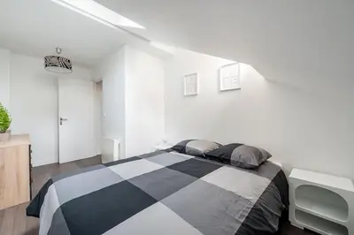 Un ou plusieurs lits dans un hébergement de l'établissement Maison en Centre-Ville - Neuilly