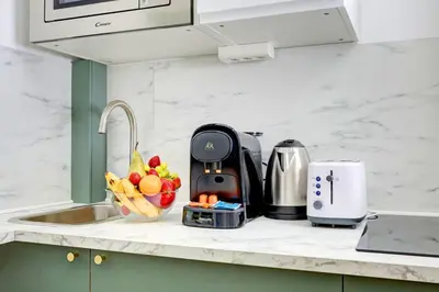 Cuisine ou kitchenette dans l'établissement 402 Suite Netter - Superbe Studio à Paris