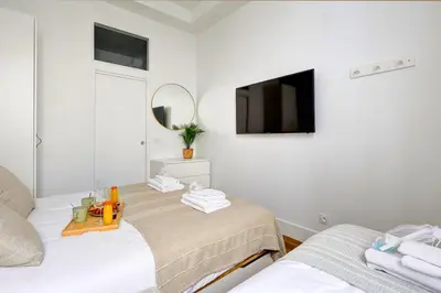 Un ou plusieurs lits dans un hébergement de l'établissement 402 Suite Netter - Superbe Studio à Paris