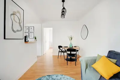 Coin salon dans l'établissement Lumineux 2 pièces Batignolles