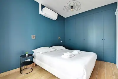 Un ou plusieurs lits dans un hébergement de l'établissement Refreshing 2BD-6P apartment - 18th ard