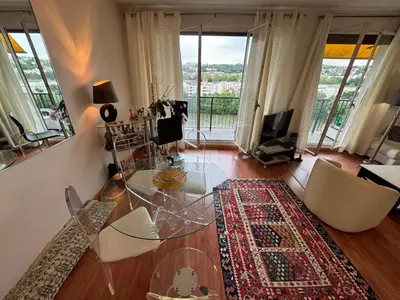 Coin salon dans l'établissement Appartement Le Boulogne