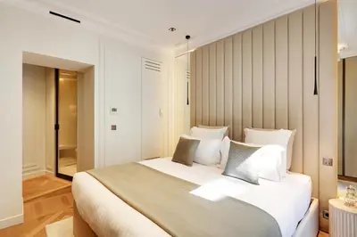 Un ou plusieurs lits dans un hébergement de l'établissement TheLander - Serviced Apartment in Le Marais