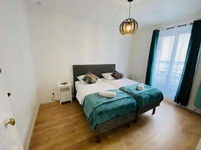 Un ou plusieurs lits dans un hébergement de l'établissement Appartement,Paris Nord,Eurostar,Thalys,Sacré-Cœur