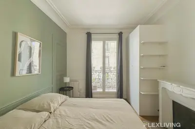Un ou plusieurs lits dans un hébergement de l'établissement Flexliving - Room - Lamarck